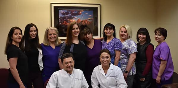 The Accord Dental team in the office, with Dr. Leon Vilner and Dr. Inna Dunker seated in front